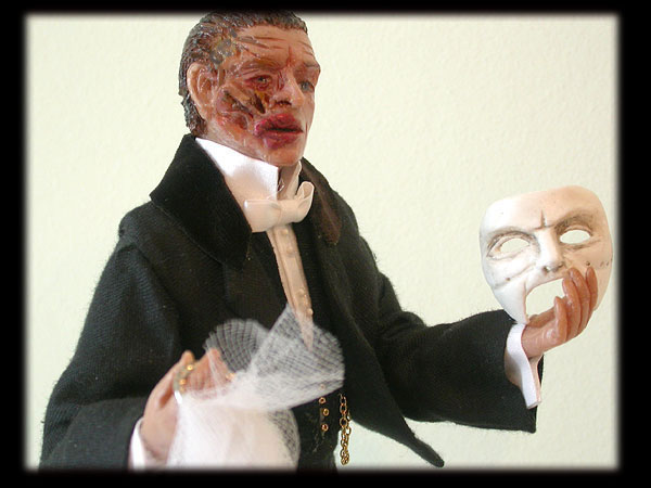 Unmasked the Phantom beseeches Christine